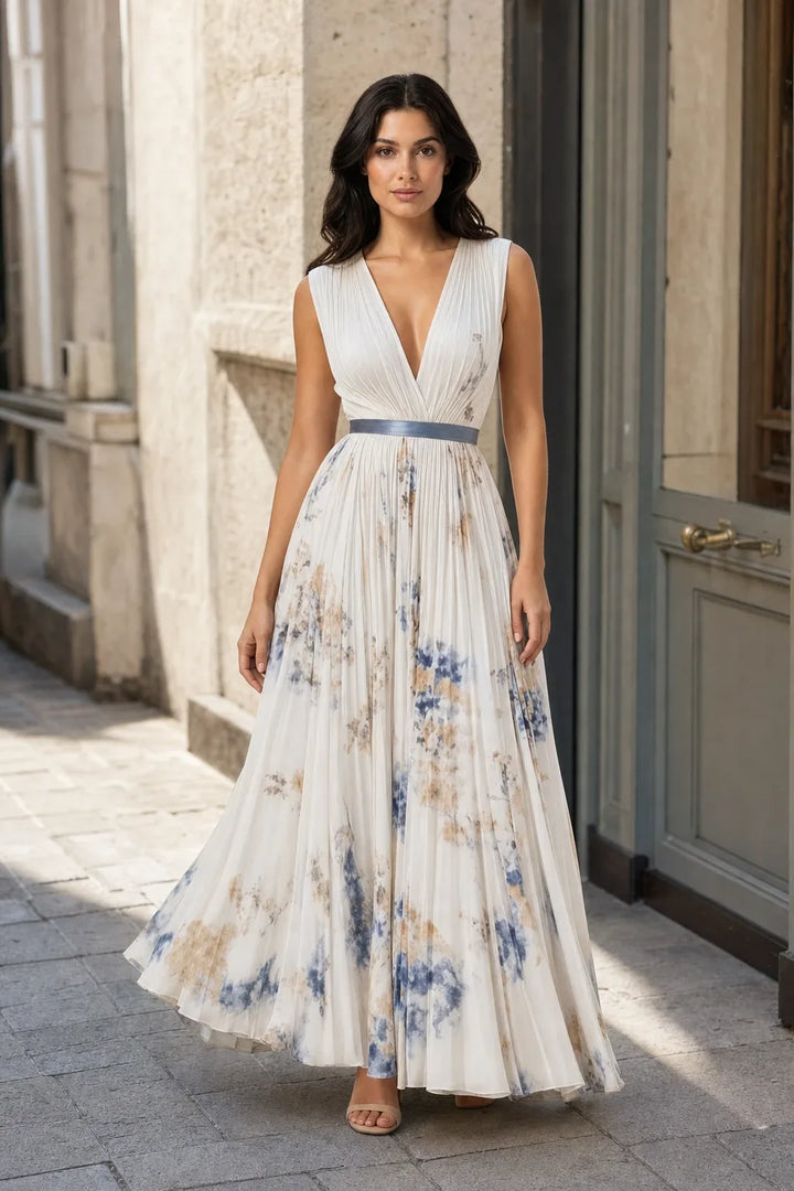 Beige pleated floral midi dress on a model in a contrapposto stance