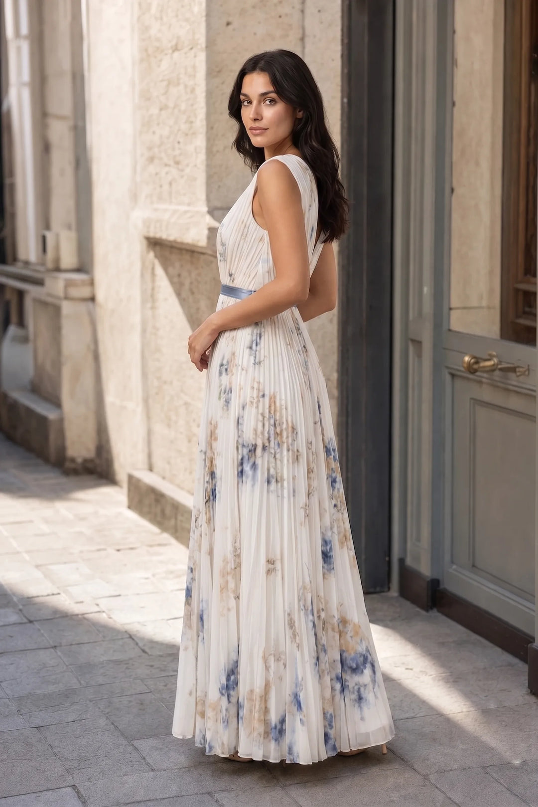 Beige pleated floral midi dress on a model in a three-quarter turn pose