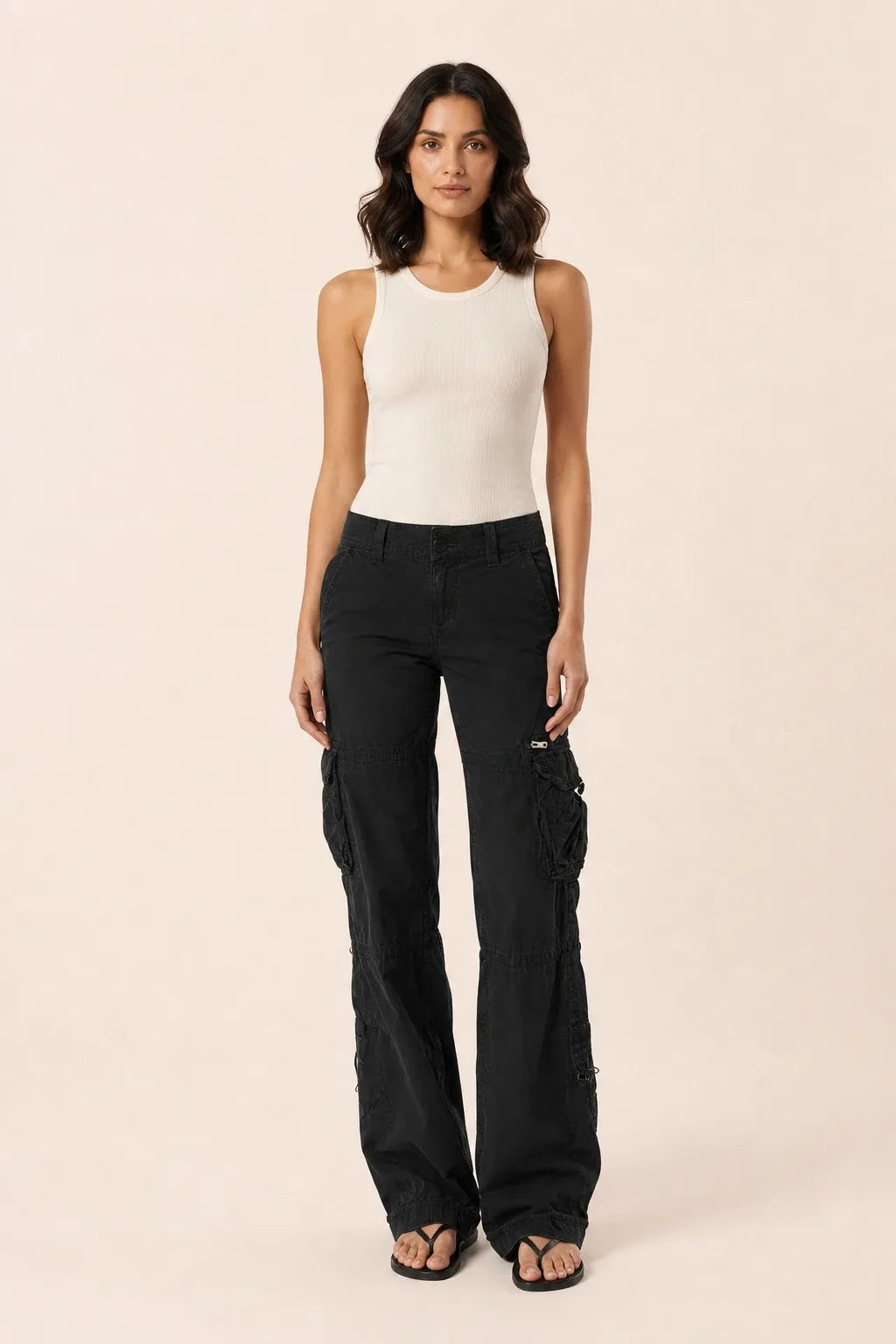 Black wide-leg cargo pants on a model in a contrapposto stance