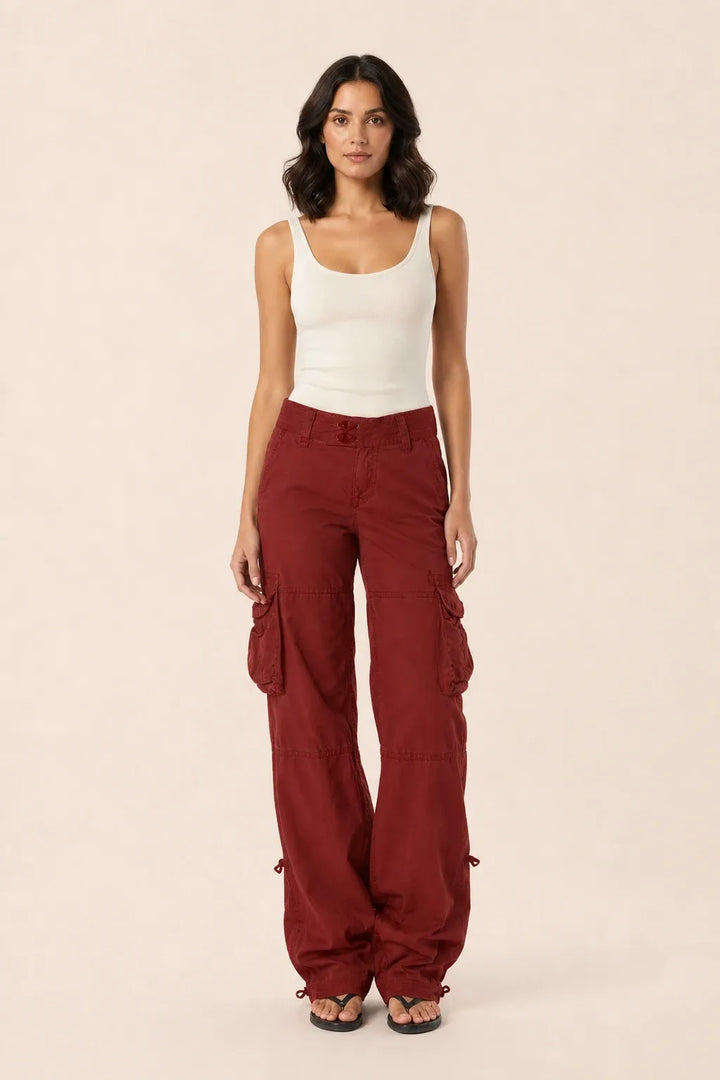 Burgundy wide-leg cargo pants on a model in a contrapposto stance