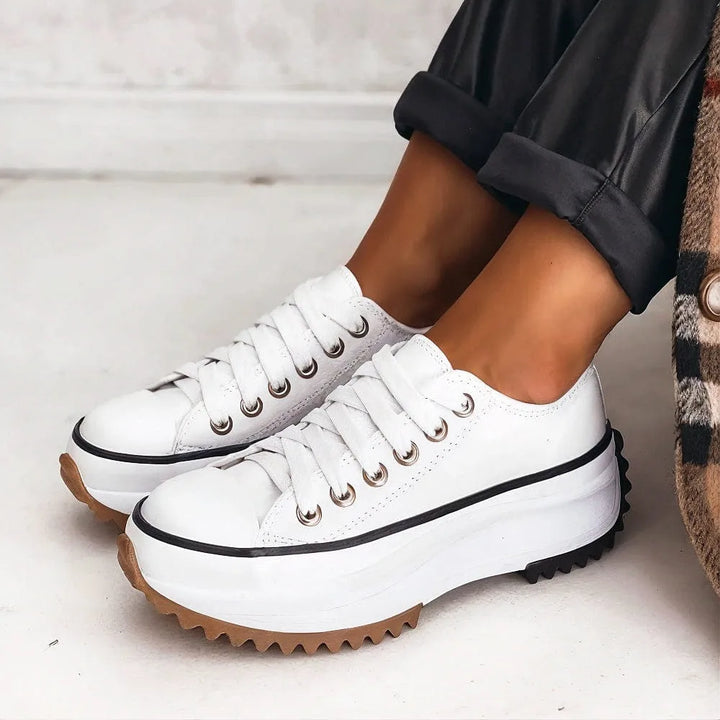 White lug sole platform sneaker, front view