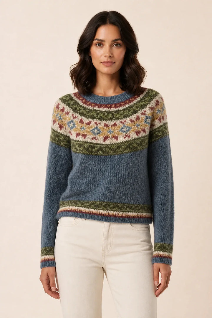 Colorblock stripe sweater in gray floral tones, model in contrapposto stance