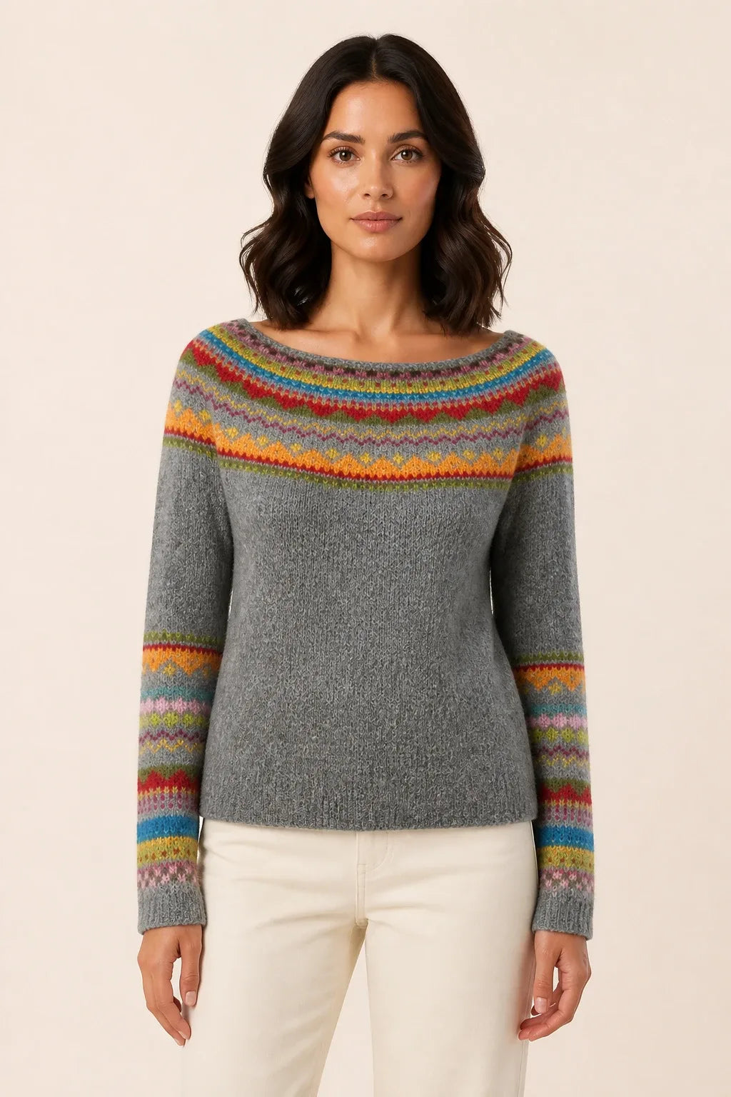 Colorblock stripe sweater in gray and rainbow tones, model in contrapposto stance