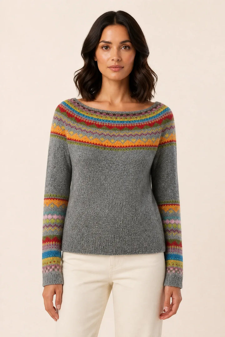 Colorblock stripe sweater in gray and rainbow tones, model in contrapposto stance