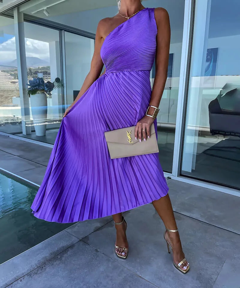 Purple pleated one-shoulder midi dress on model in side profile
