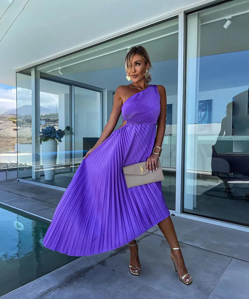 Purple pleated one-shoulder midi dress on model at three-quarter turn
