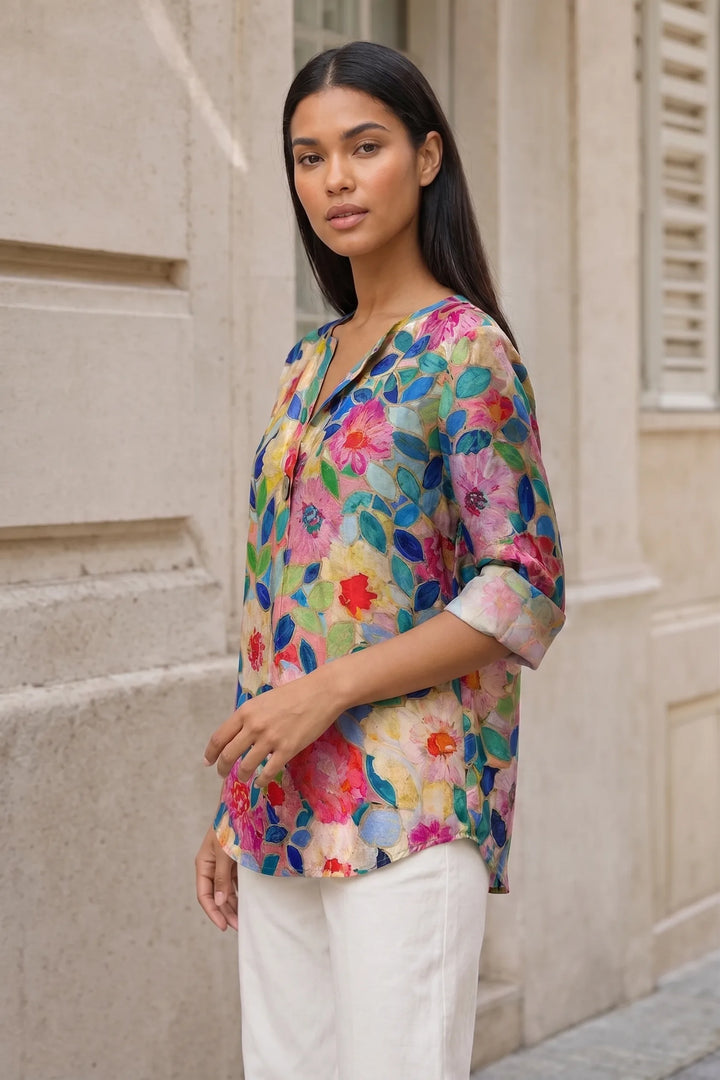 Blue floral print blouse on model in three-quarter turn