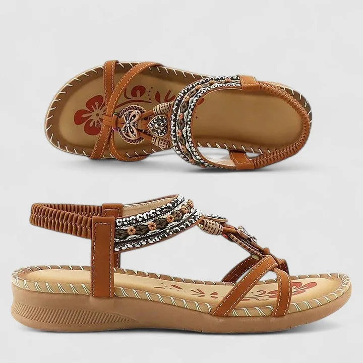 Beige beaded flat sandal with neutral-toned boho strap detailing