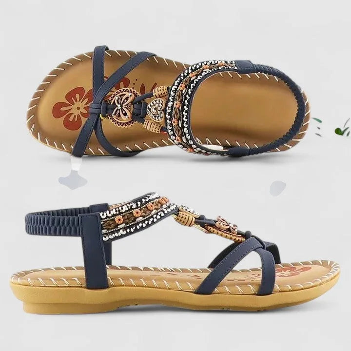 Cobalt blue beaded flat sandal with boho-style straps, front view