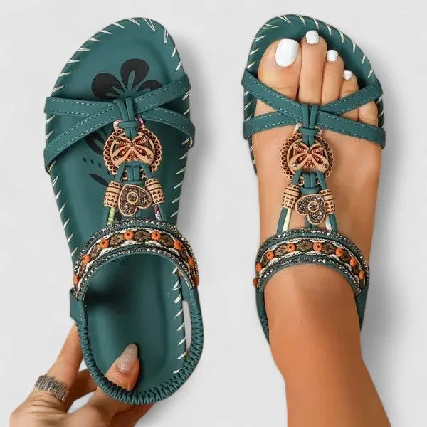 Close-up detail of forest green beaded flat sandal boho strap embellishment