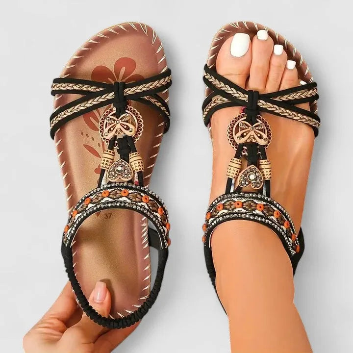 Light black beaded flat sandal with boho-style straps and flat sole