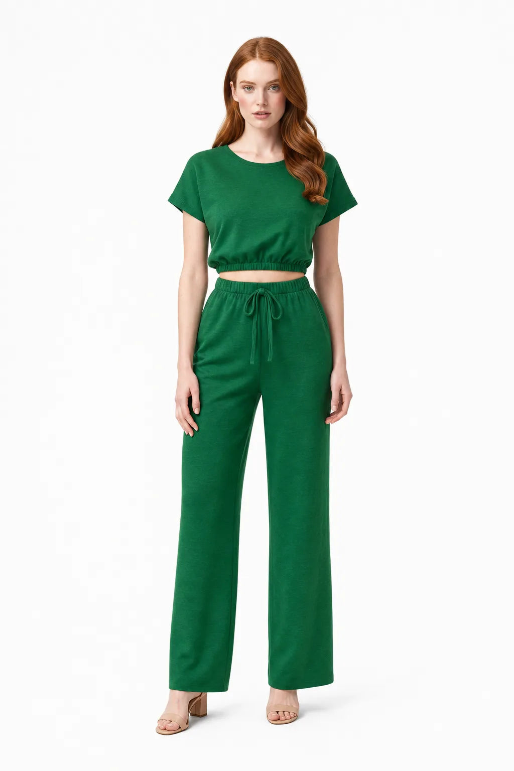 Dark green crop top and wide-leg trouser co-ord set on model in contrapposto stance