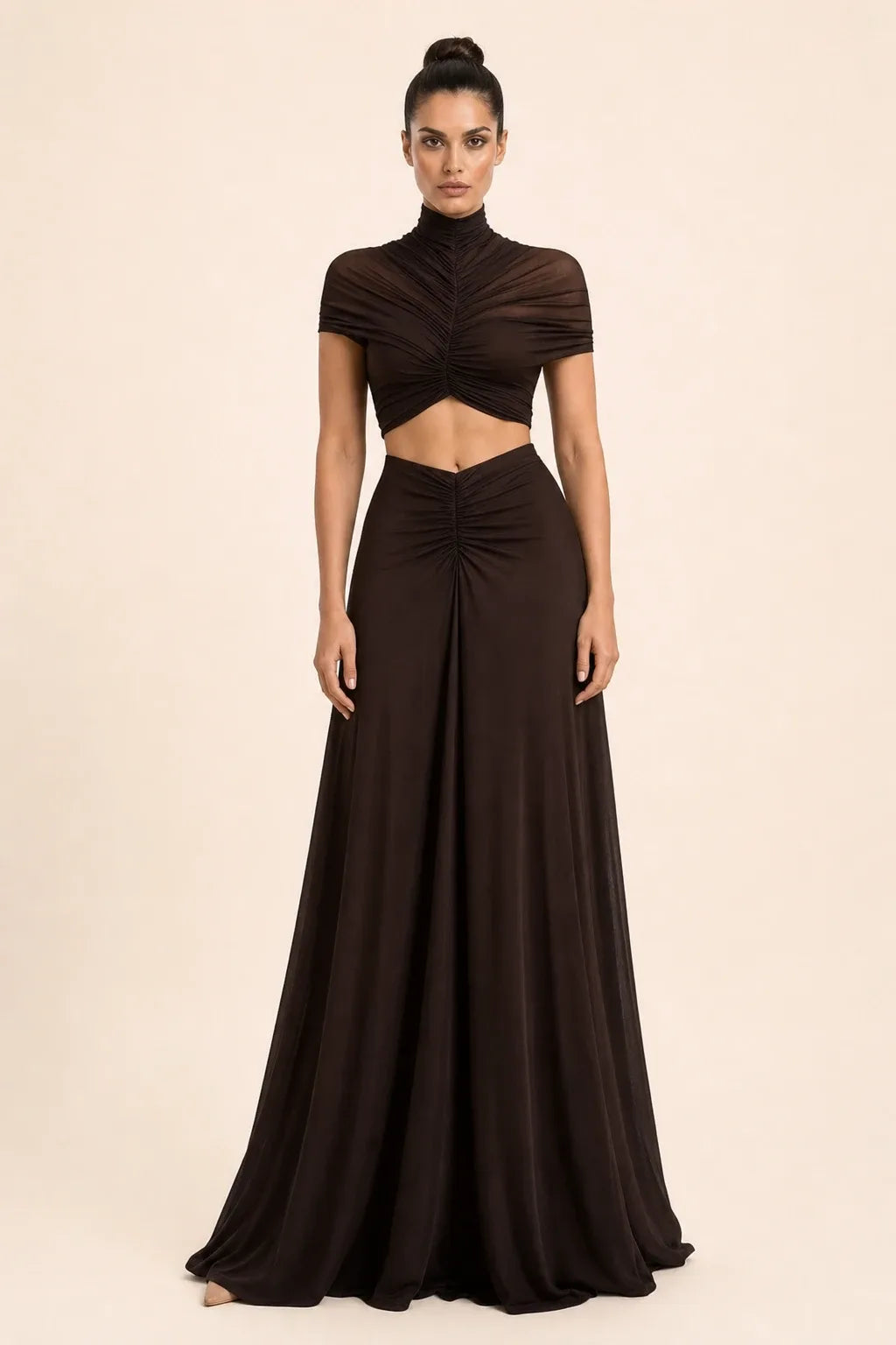 Coffee-toned ruched cut-out maxi dress on model in contrapposto stance