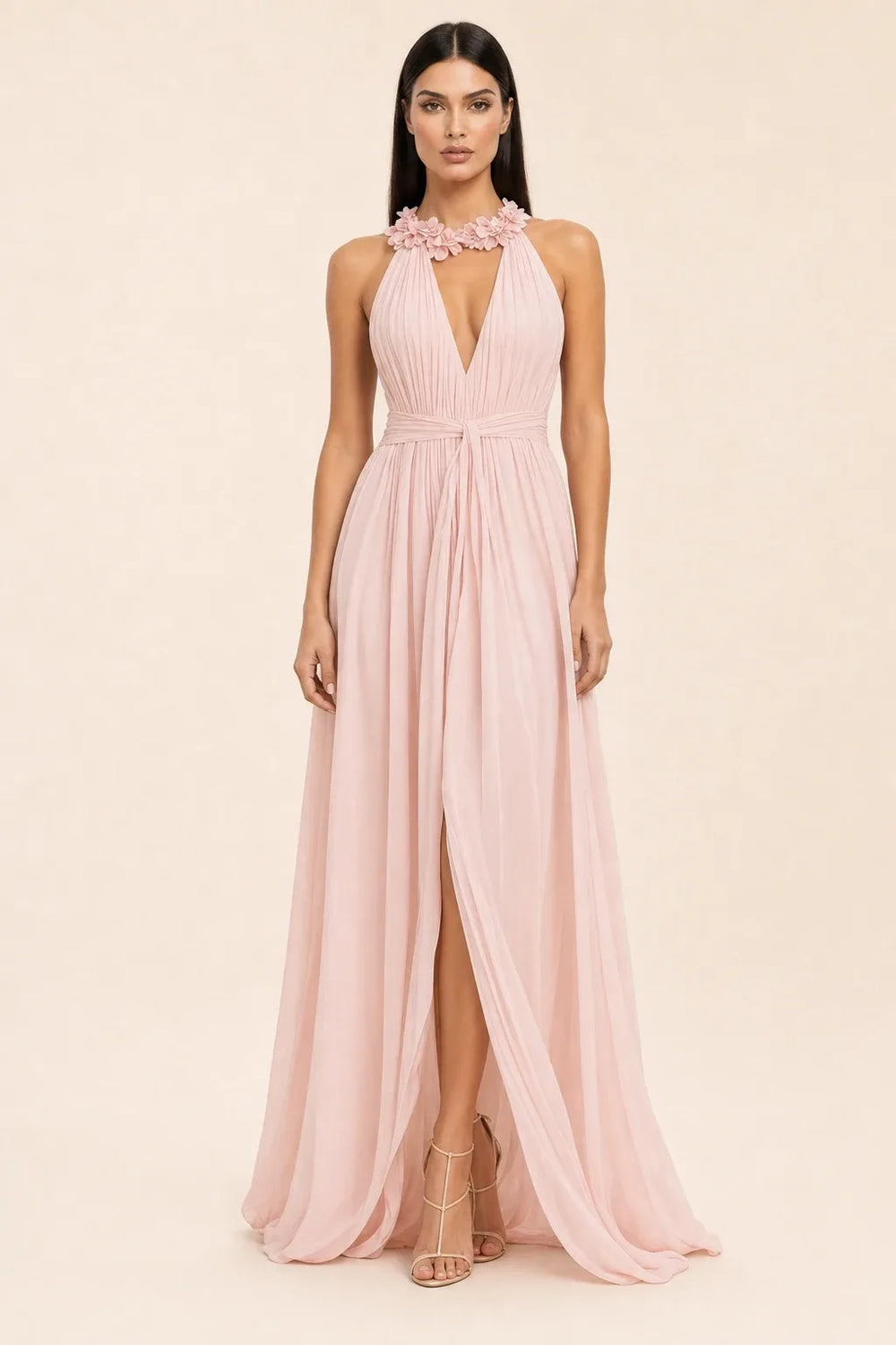 Pink floral halter maxi dress on model in contrapposto stance