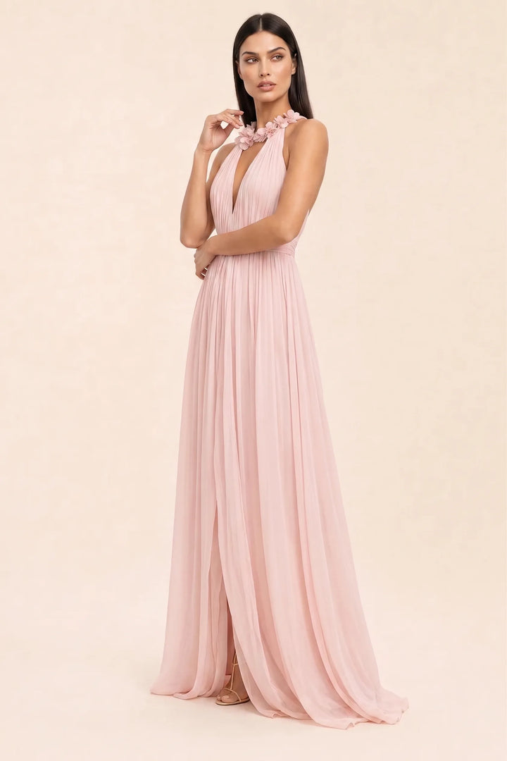 Pink floral halter maxi dress on model in three-quarter turn