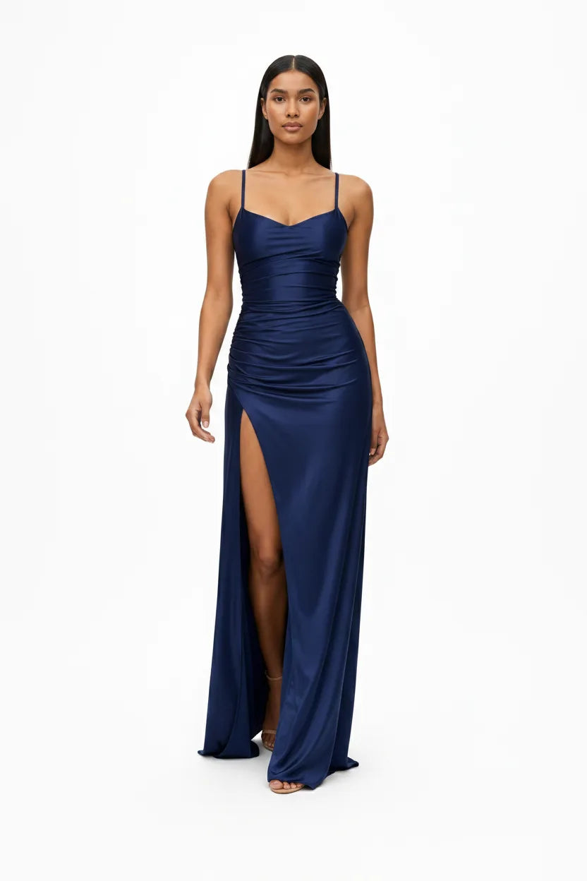 Navy blue ruched satin gown on a model in natural movement