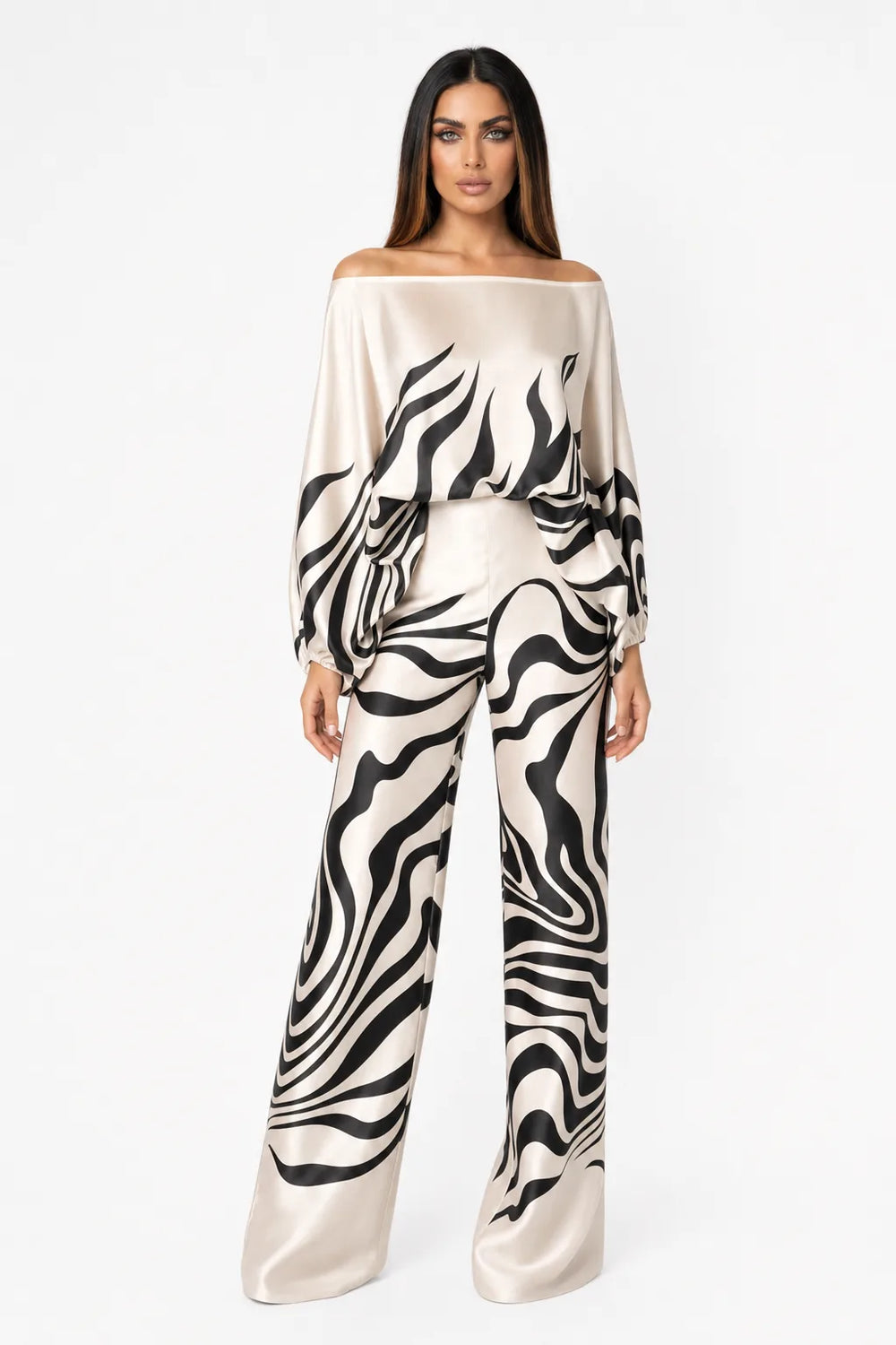 Black abstract print matching trouser set on model in contrapposto stance