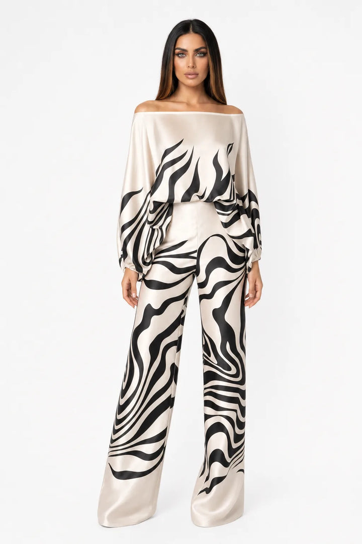 Black abstract print matching trouser set on model in contrapposto stance