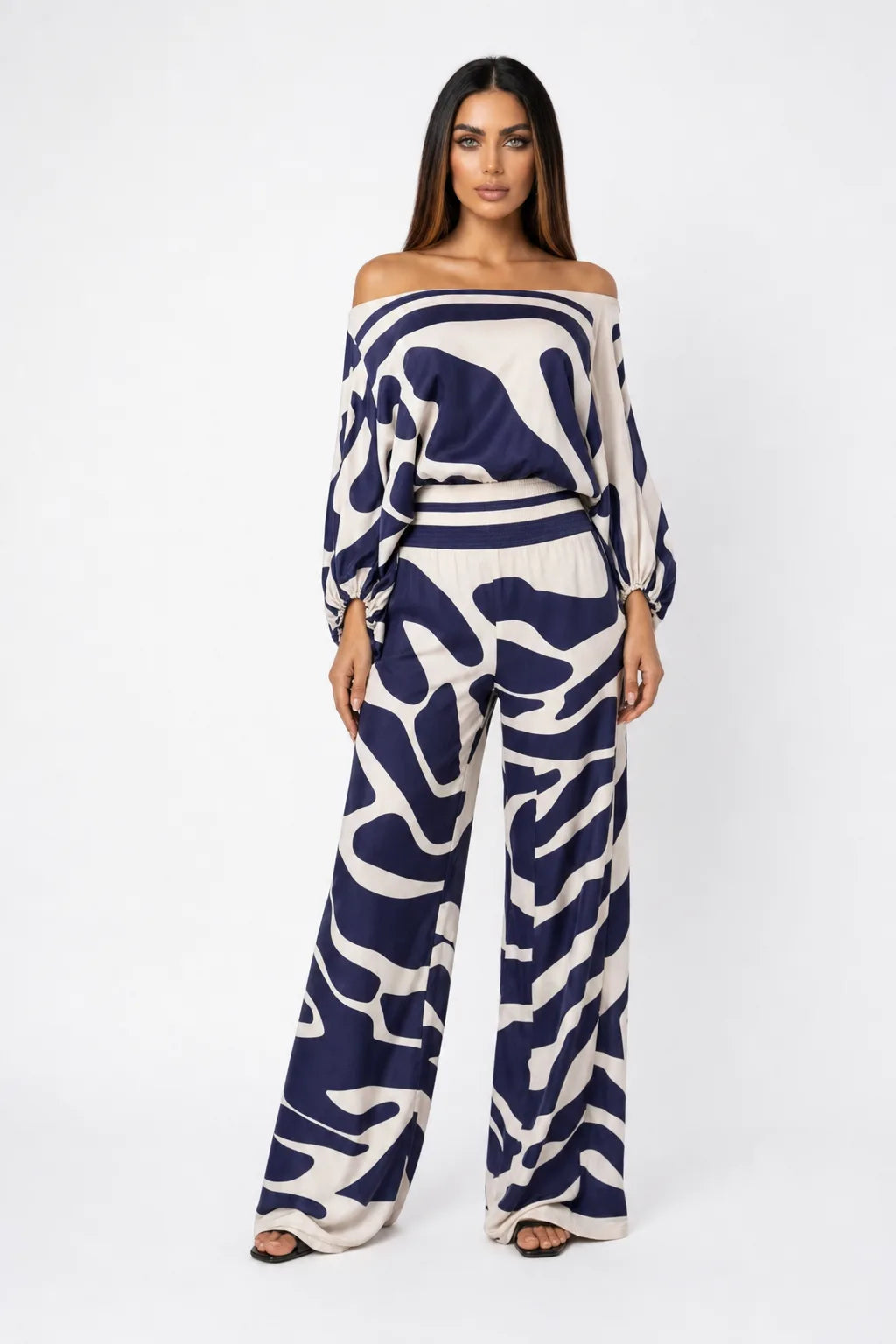 Blue abstract print matching trouser set on model in contrapposto stance