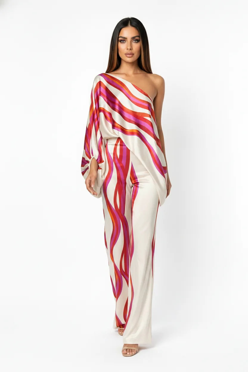Fuchsia abstract print matching trouser set on model in natural movement