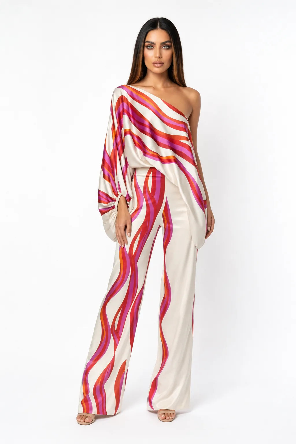 Fuchsia abstract print matching trouser set on model in contrapposto stance