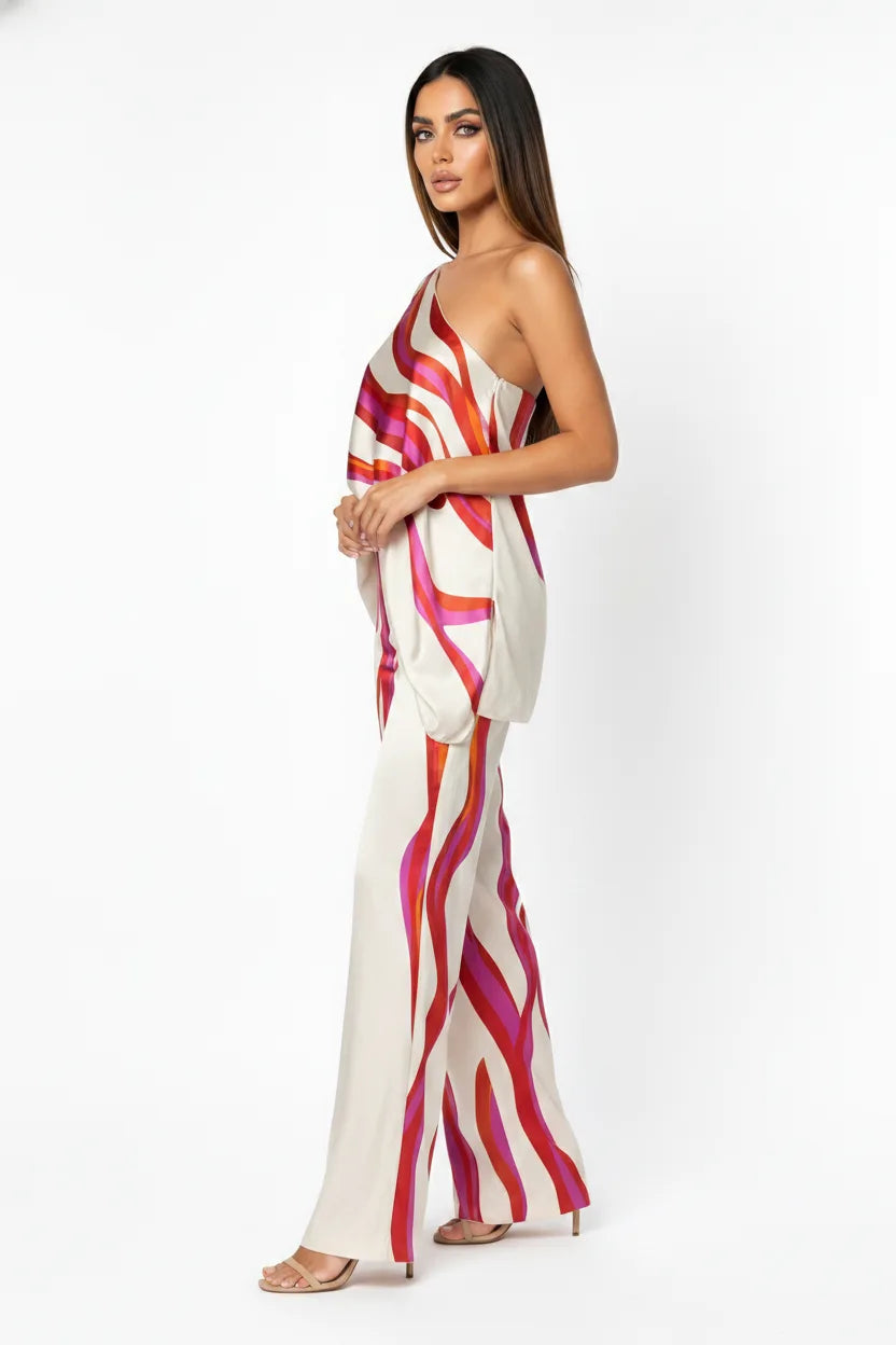 Fuchsia abstract print matching trouser set on model in three-quarter turn