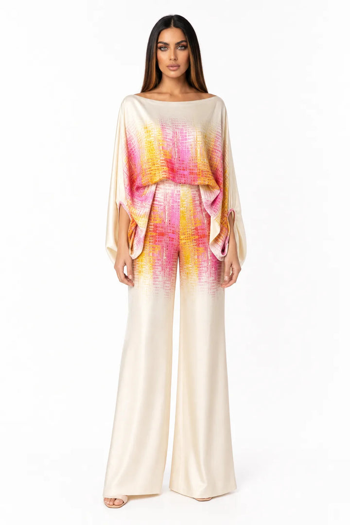 Pink abstract print matching trouser set on model in contrapposto stance