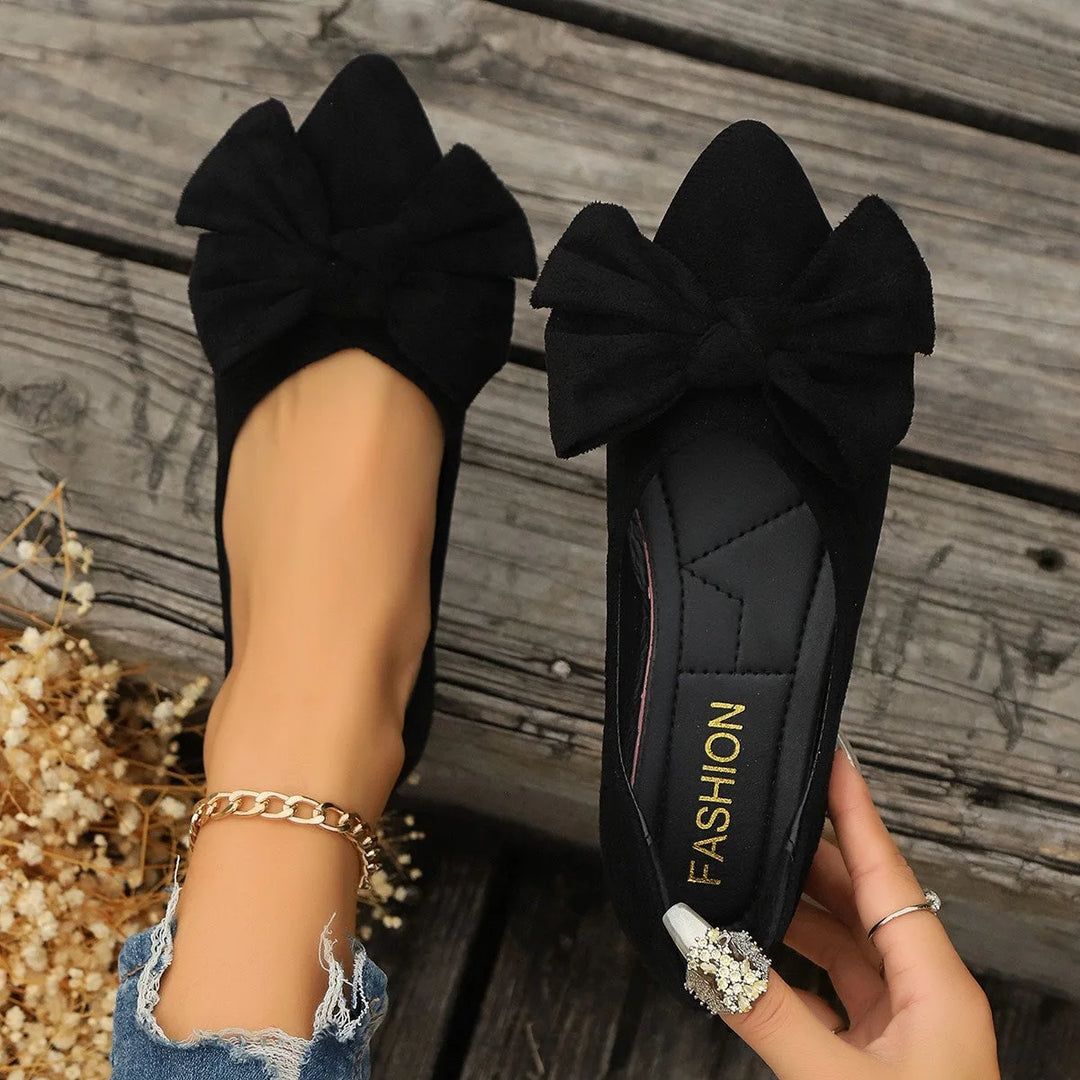 Black ballet flat with bow detail, front view