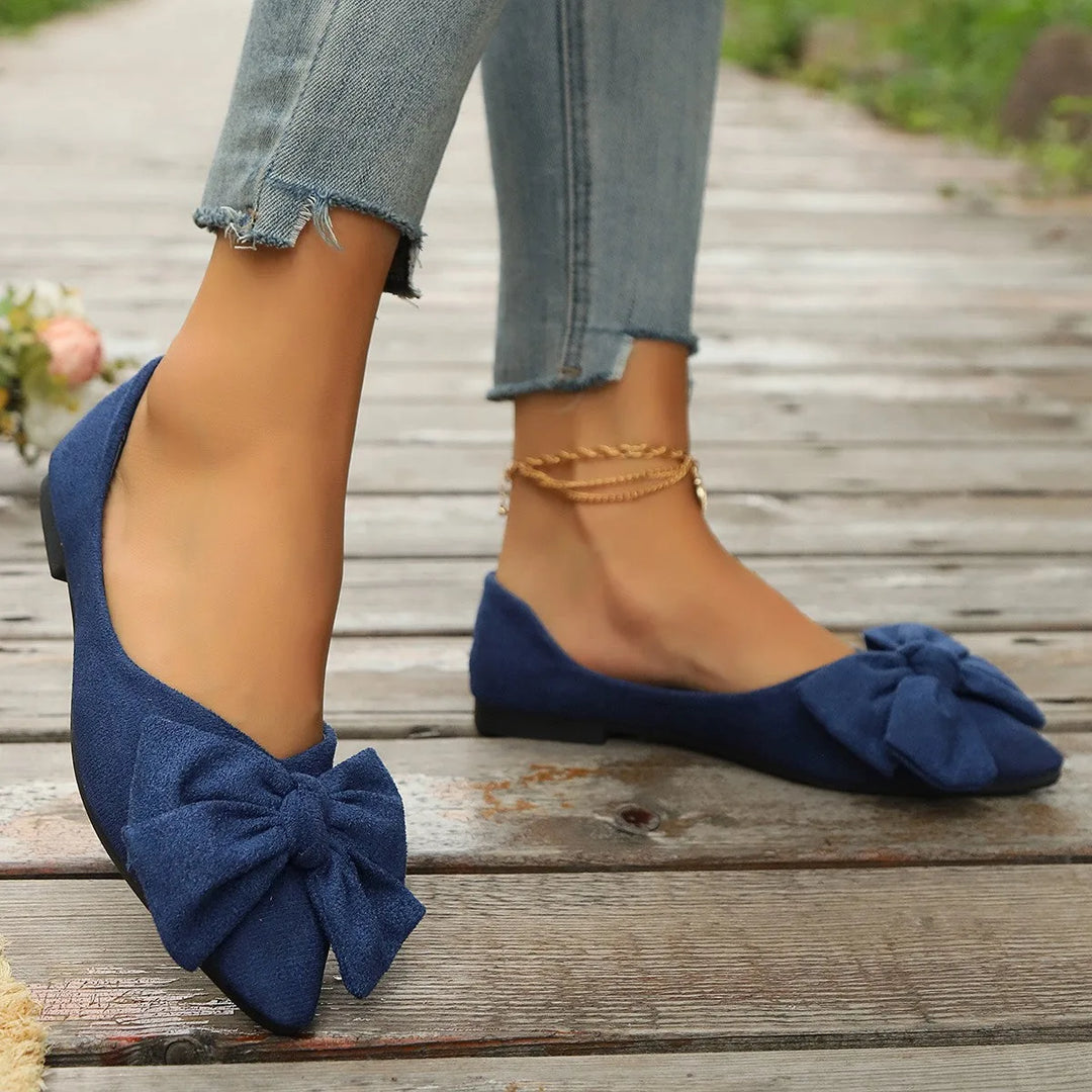 Dark blue ballet flat with bow detail, alternate angle view