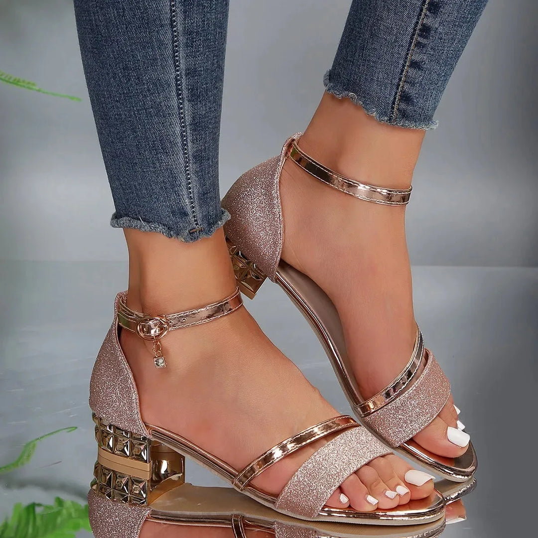 Black glitter block heel sandal, rear view showing block heel and ankle strap closure