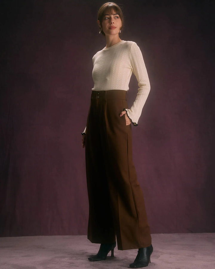 Model styled in wide-leg coffee brown trousers in a relaxed standing pose