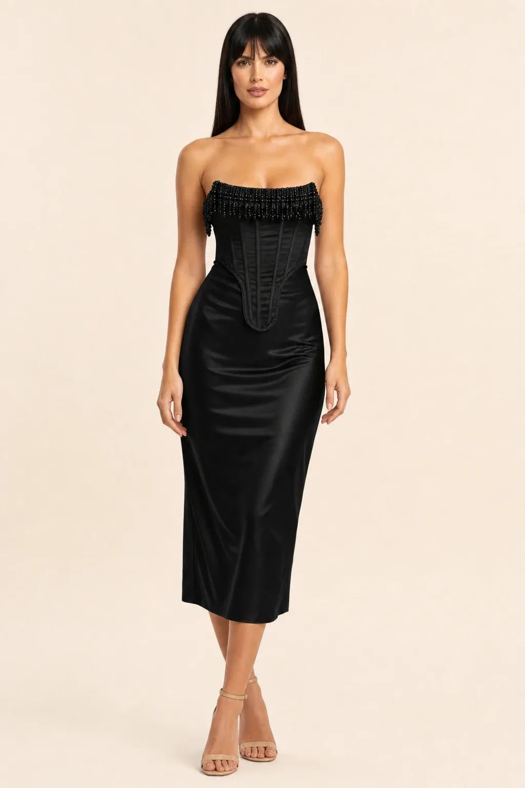 Black fringe corset midi dress on model in contrapposto stance