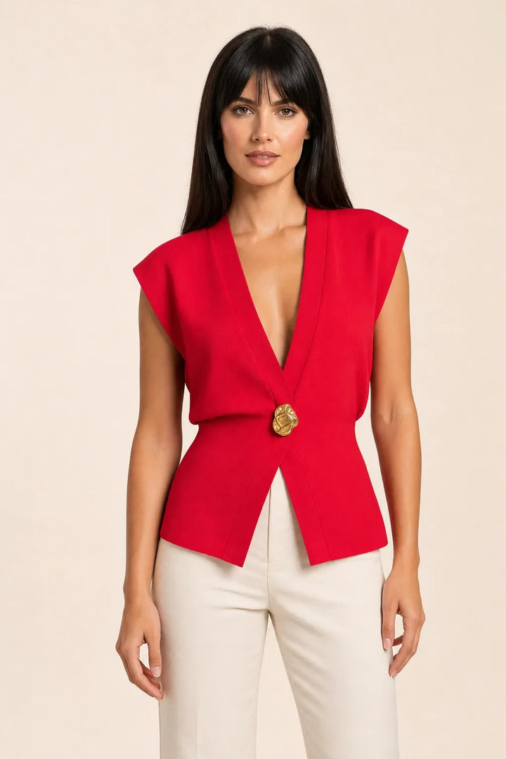 Red button-front vest top on model in contrapposto stance