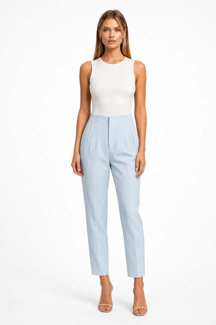 Light blue pleated tapered trousers on a model in a contrapposto stance