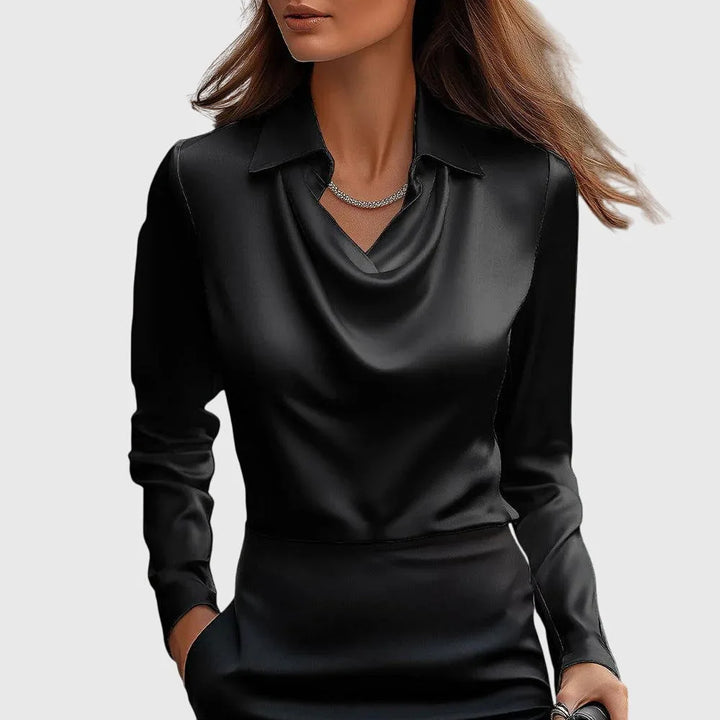 Black satin cowl neck blouse on model from the side