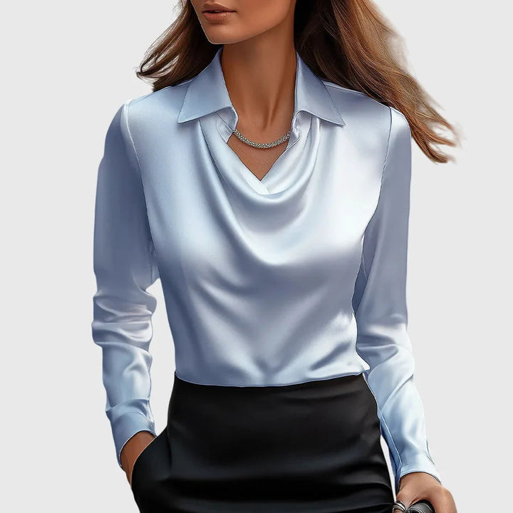 Light blue satin cowl neck blouse fabric and drape detail closeup
