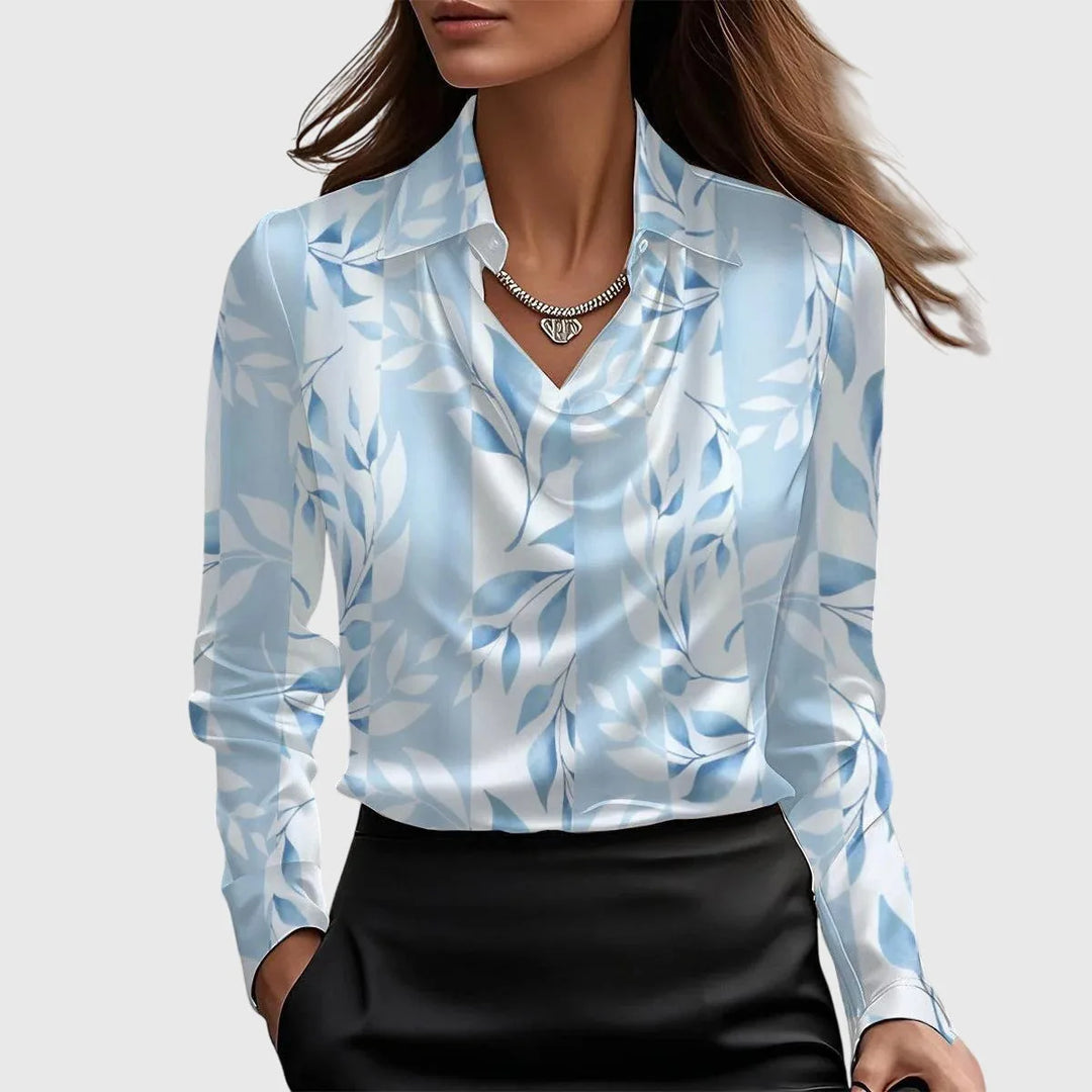 Light blue floral satin cowl neck blouse on standing model