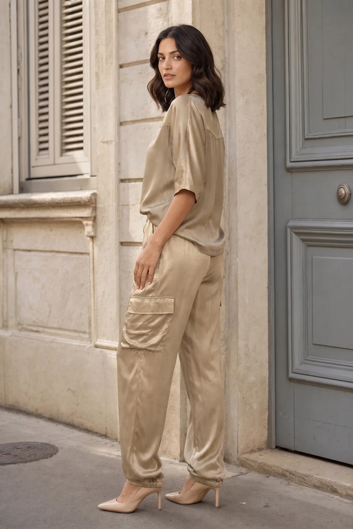 Gold satin cargo co-ord set on model in three-quarter turn