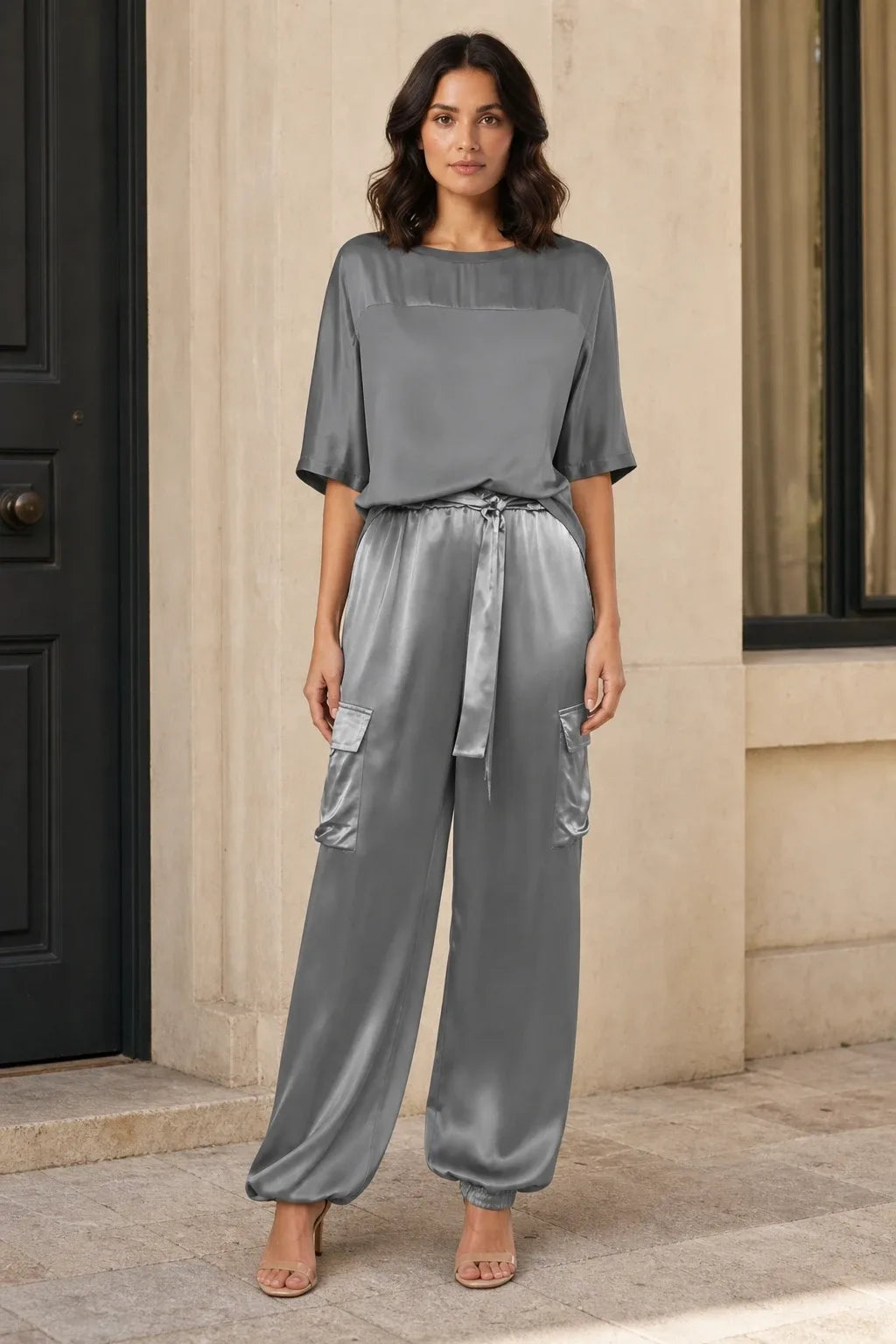 Grey satin cargo co-ord set on model in contrapposto stance