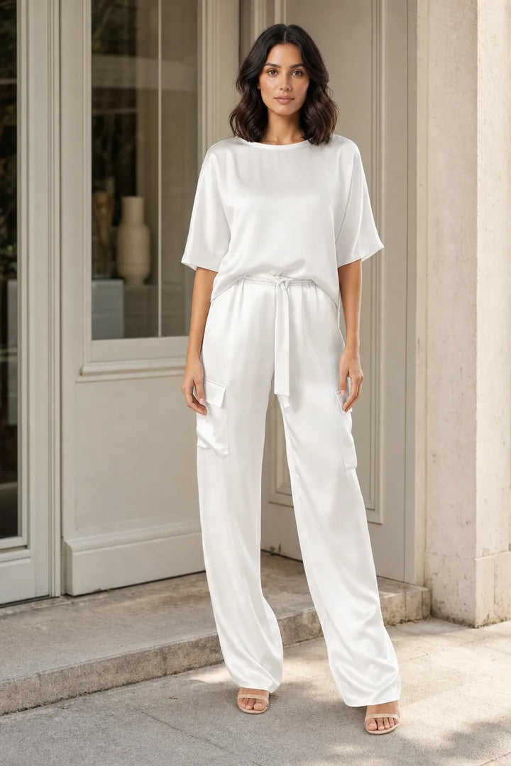White satin cargo co-ord set on model in contrapposto stance