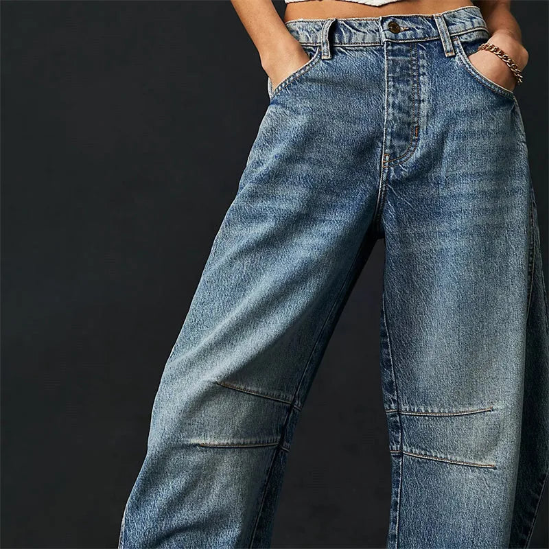 Light blue barrel leg jeans on model, styled full-length view