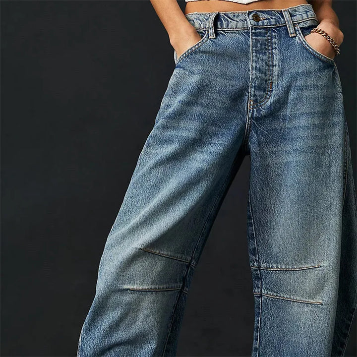 Light blue barrel leg jeans on model, styled full-length view