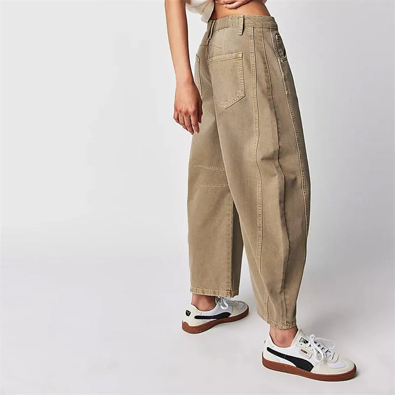 Light blue barrel leg jeans on model, full-length styled outfit view