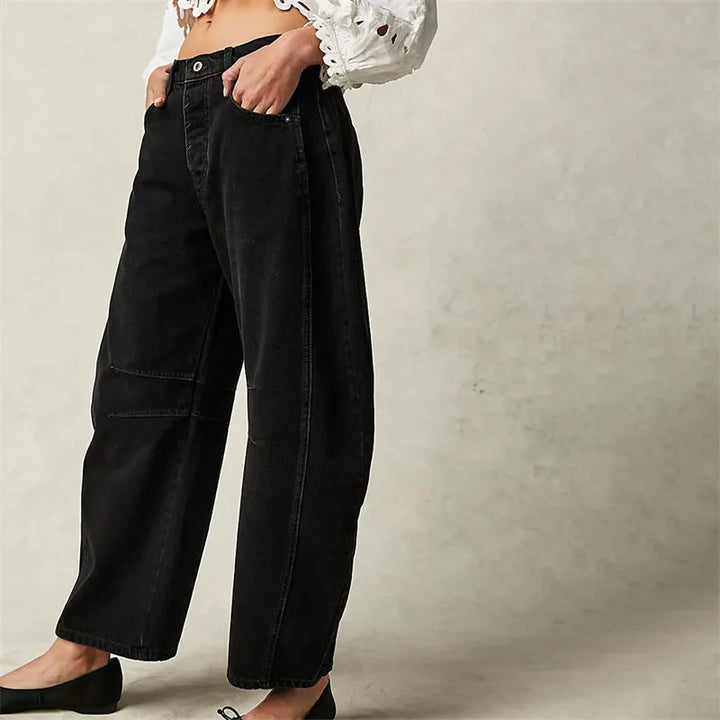 Light blue barrel leg jeans on model, full-length front view with cropped hem