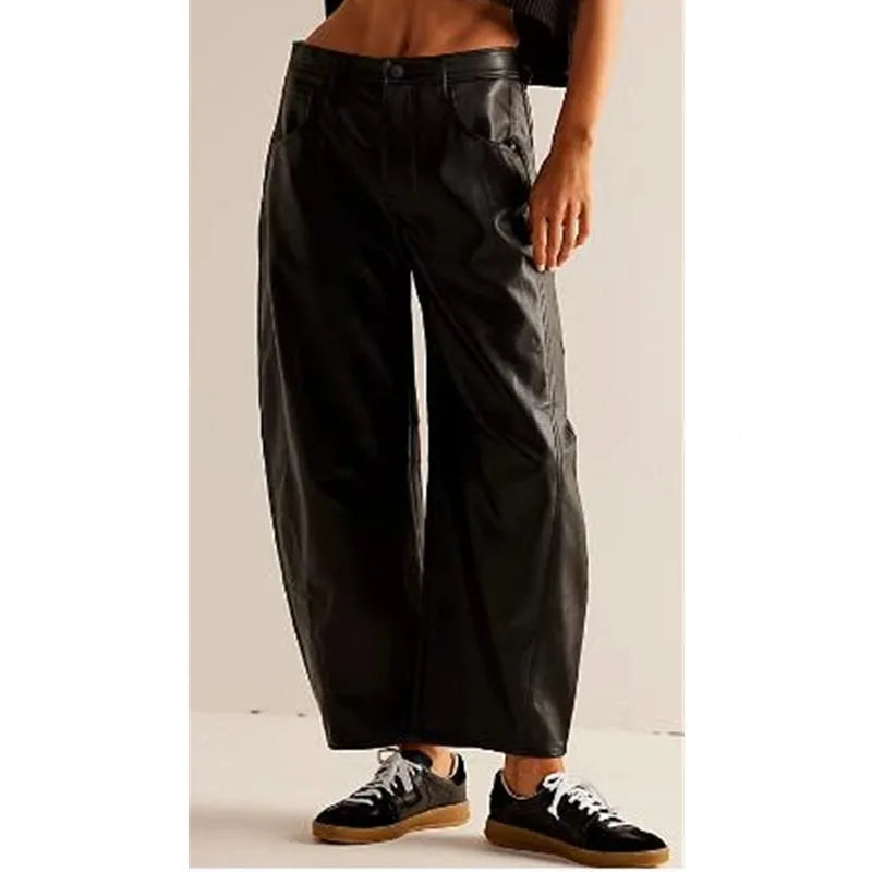 Light blue barrel leg jeans on model, full-length view from slight side angle