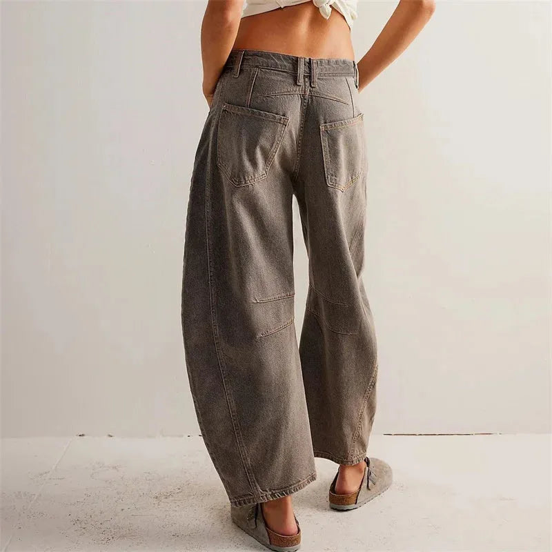 Light blue barrel leg jeans on model, full-length view showing overall fit