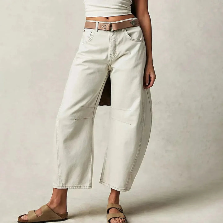White barrel leg jeans on model, full-length view showing barrel-shaped leg