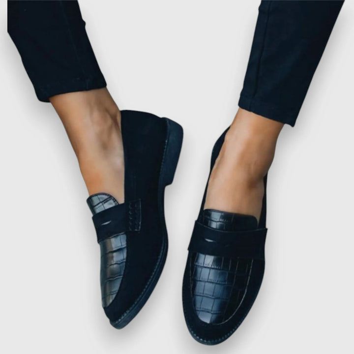 Front view of a croc panel penny loafer in a neutral tone