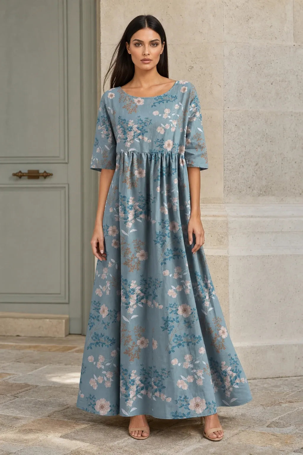 Light blue floral midi dress on model in contrapposto stance