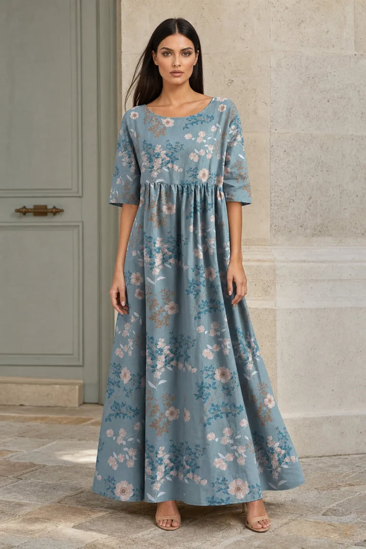 Light blue floral midi dress on model in contrapposto stance